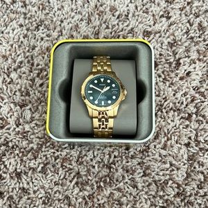 FOSSIL WATCH FB-01 Three-Hand Date
Gold-Tone Stainless
Steel Watch